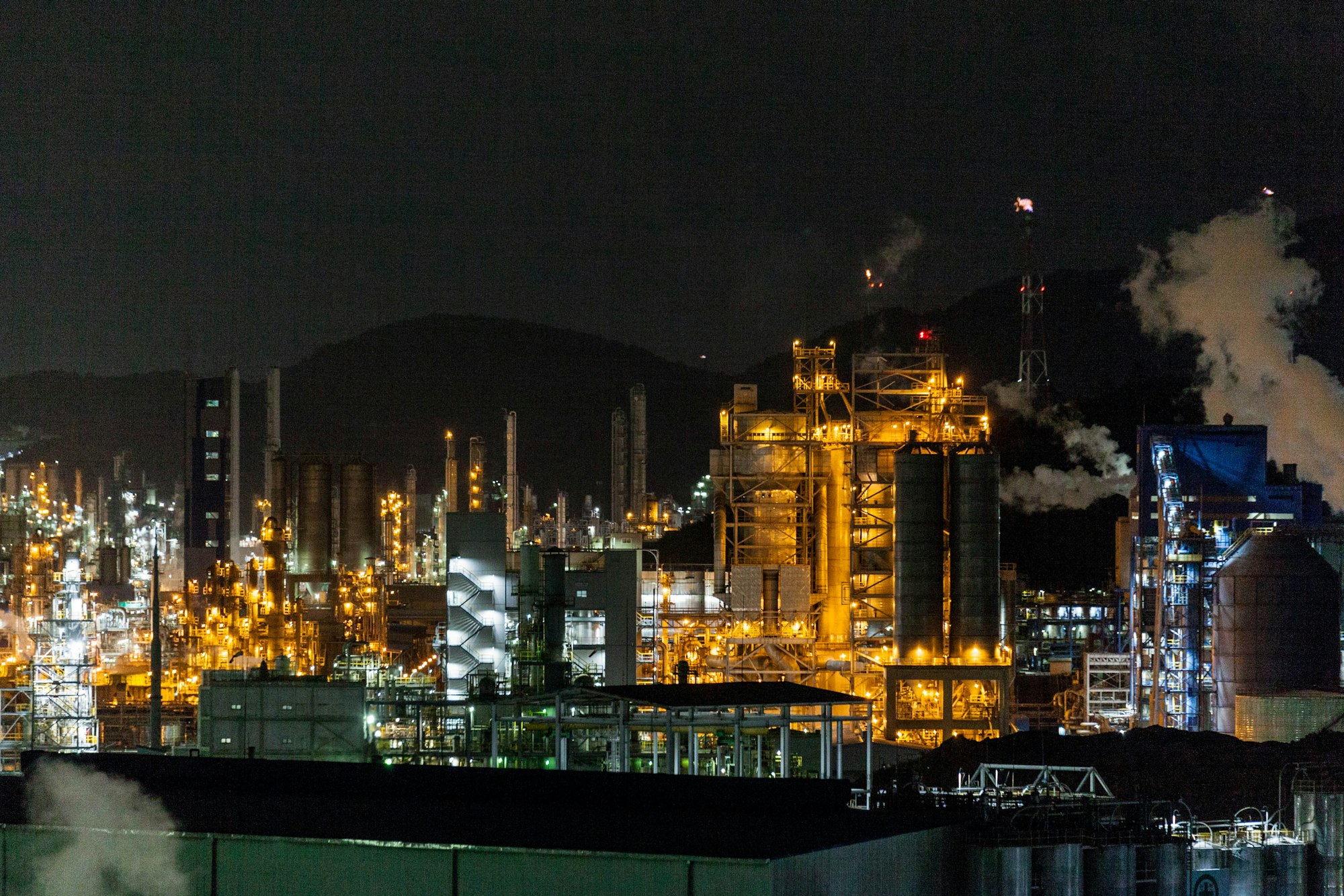 Industrial processing plant illuminated at night