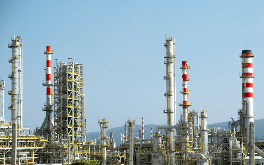 Refinery process units with red and white pipework